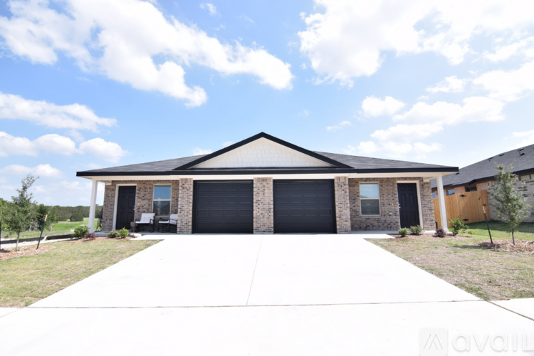 A house with a garage is for sale.