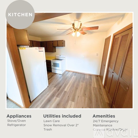 A kitchen with a refrigerator, stove, oven, and a ceiling fan.