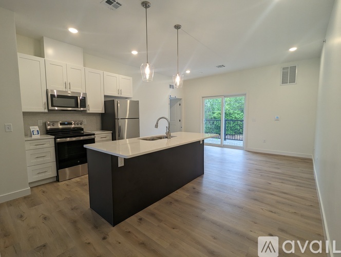 A kitchen with a large island in the middle of the room.