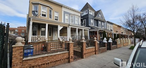 A row of houses with a sign that says "available" in front of the first one.