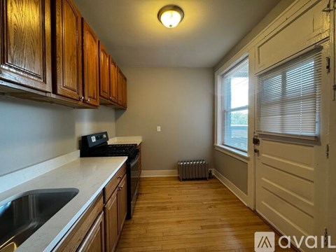 A kitchen with white cabinets and stainless steel appliances.