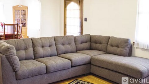 A grey sectional sofa in a living room.