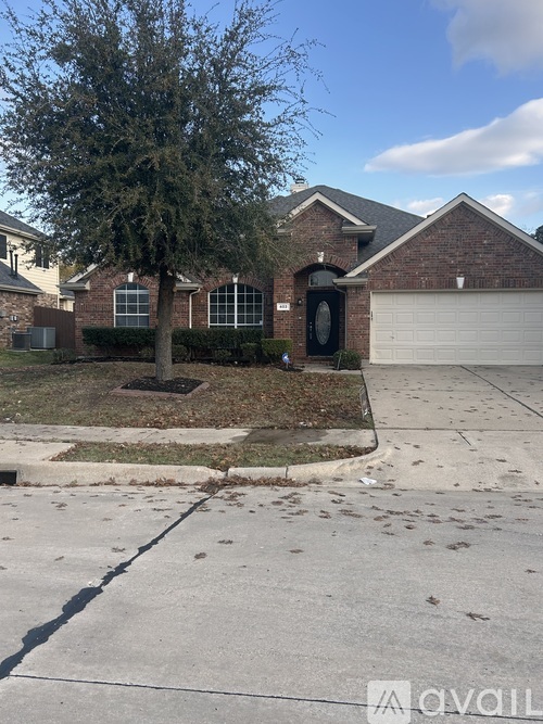 A house with a tree in front of it.