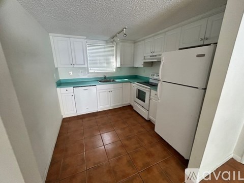 A room with a tiled floor and a ceiling fan.