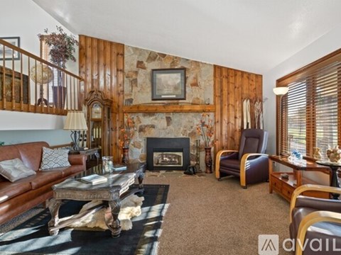 A living room with a fireplace and a couch.