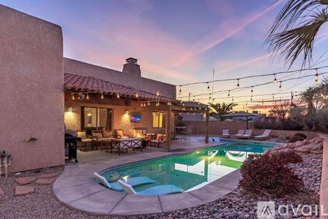 A house with a pool in the backyard.