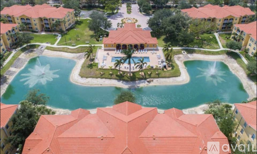 A bird's eye view of a resort with a pool and fountain.