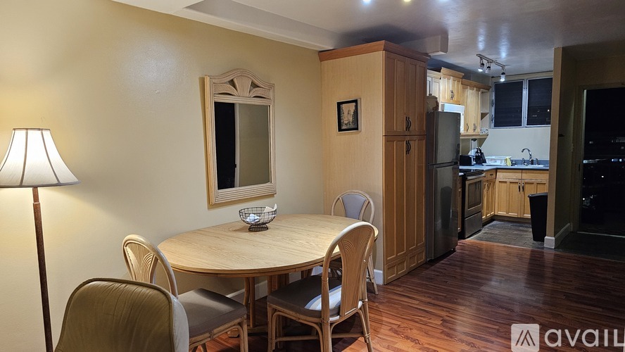 A dining area with a table and chairs is shown.