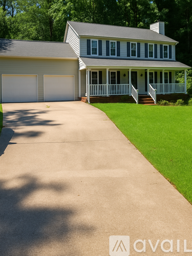 A house with a driveway in front of it.