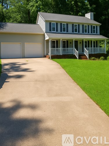 A house with a driveway in front of it.