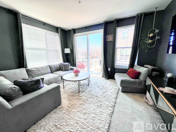 A living room with grey couches and a coffee table.