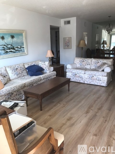 A living room with two couches and a coffee table.