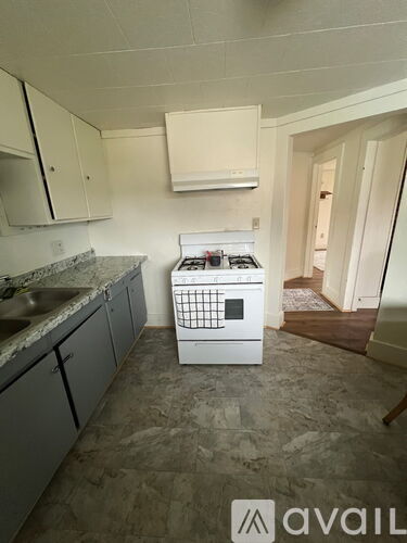 A kitchen with a dishwasher in the middle of the room.