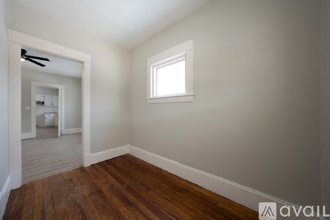 A room with a window and a door.