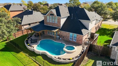 A house with a pool in the backyard.