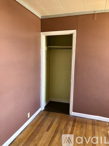 A room with a doorway leading to another room.