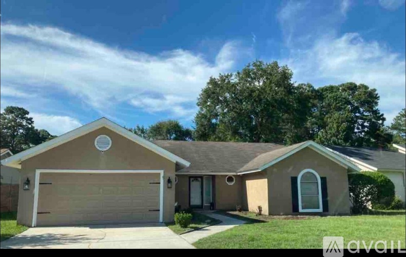 A house with a brown garage door is for sale.