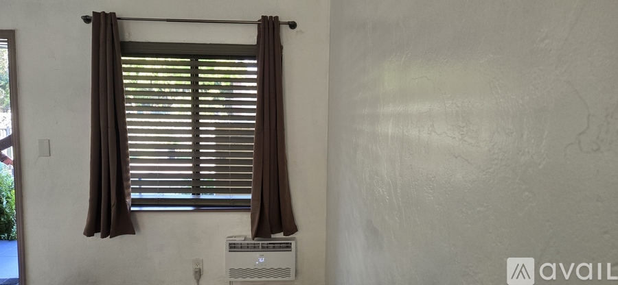 A white door is open to a storage area.