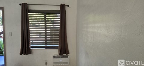 A white door is open to a storage area.