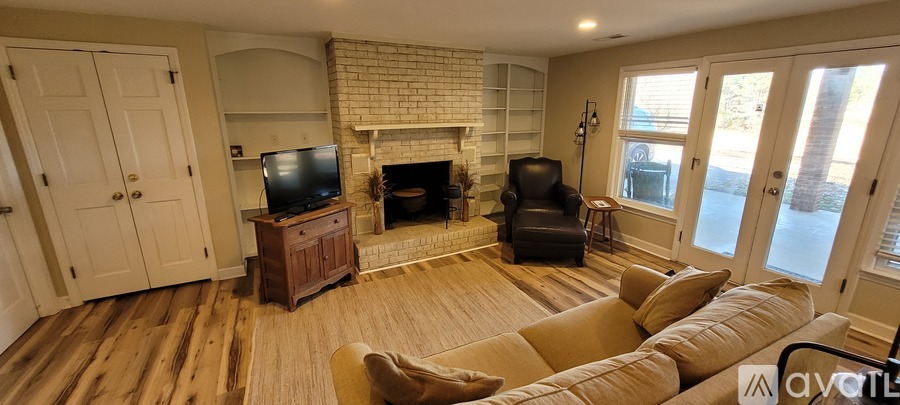A living room with a fireplace and a couch.