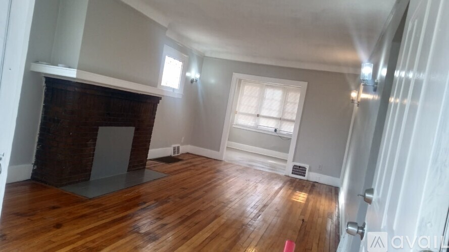 A room with white marble tiles on the floor.