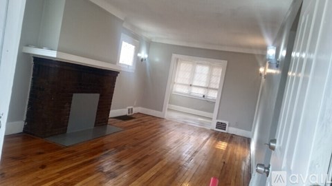 A room with white marble tiles on the floor.