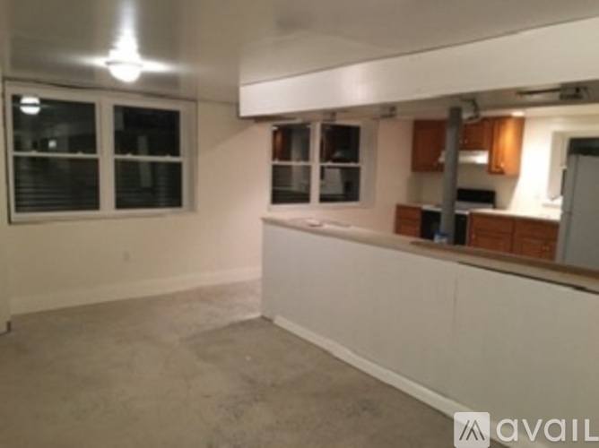 A room with a window and a counter.