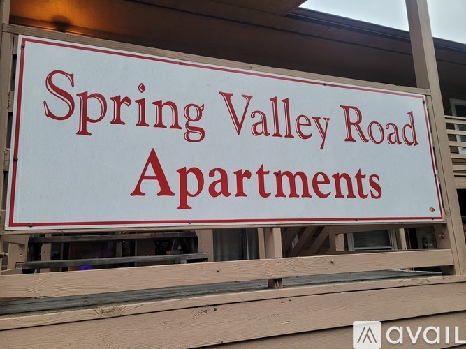Spring Valley Road Apartments is written on a sign.