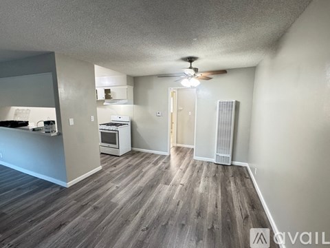 A small white kitchen with a washing machine and a dishwasher.