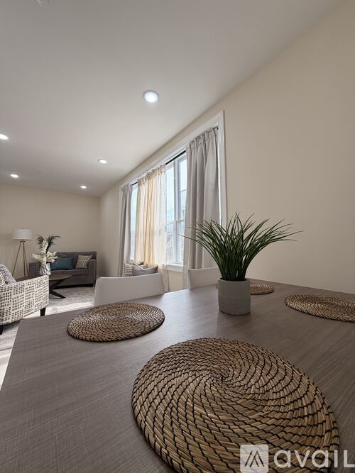 A room with wooden flooring and two white doors.