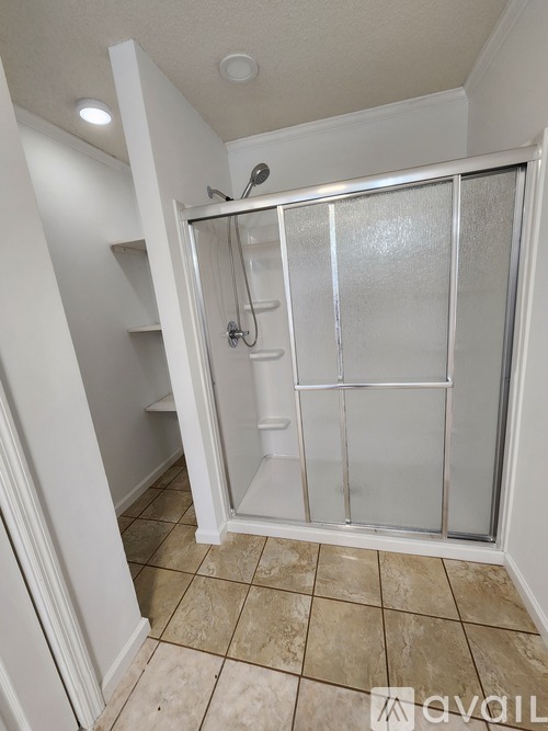 A small bathroom with a walk-in shower.
