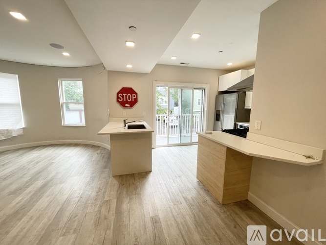 A room with a stop sign on the wall and a desk in the middle.