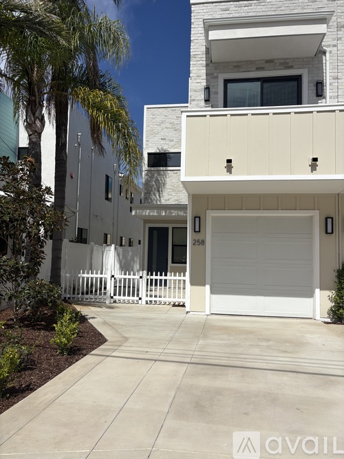 A modern house with the number 258 on the front door.