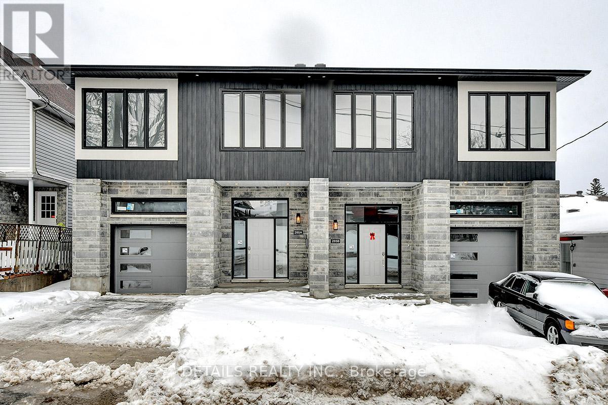 A grey house with a car parked in front.