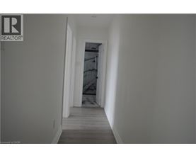 A long hallway with a door at the end.
