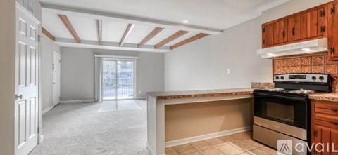 A kitchen with a stove top oven and a counter top.