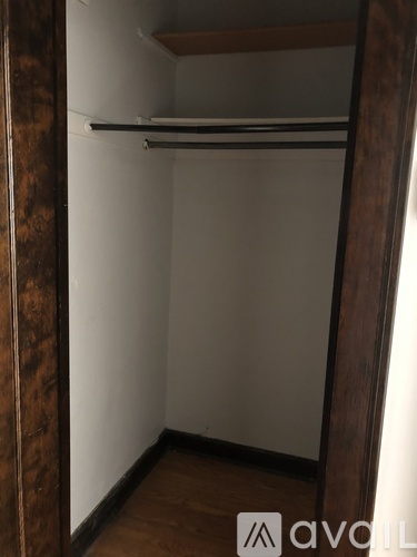 A small, empty closet with a shelf above the door.