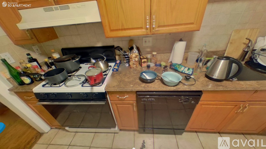A kitchen with wooden cabinets and a stove top oven.