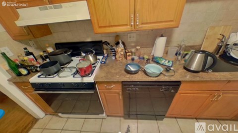 A kitchen with wooden cabinets and a stove top oven.