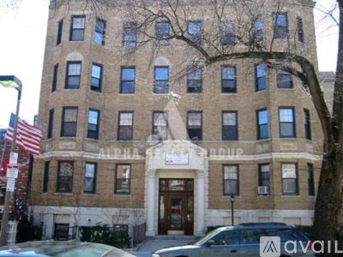 A building with a sign that says "AVAILABLE" in front of it.