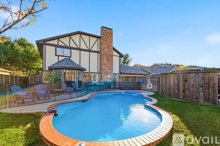 A house with a pool in the backyard.
