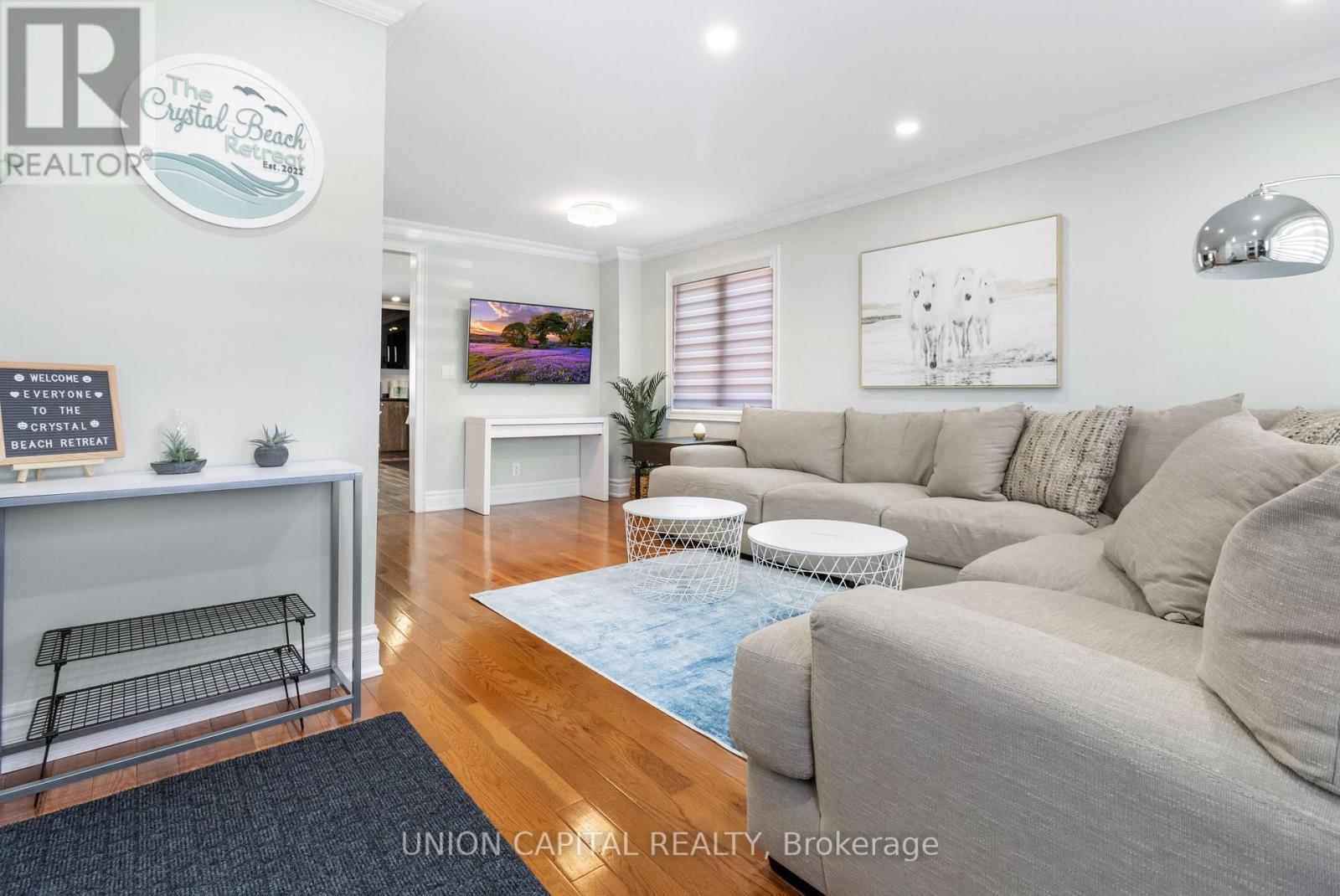 A living room with a couch, a chair, and a table.