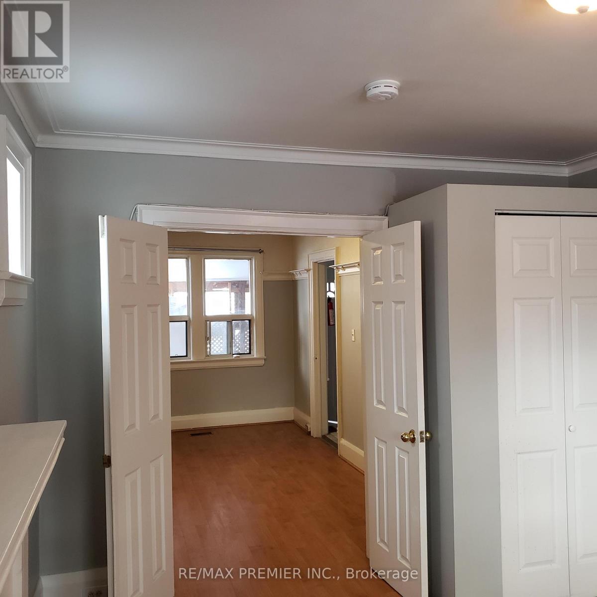 A room with a doorway leading to another room.