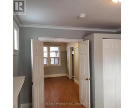 A room with a doorway leading to another room.
