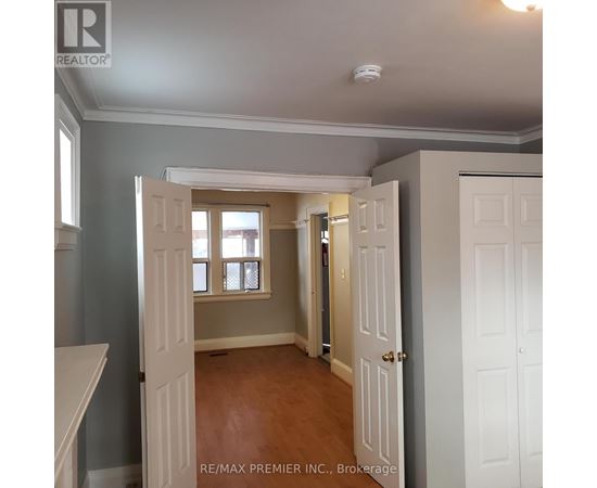 A room with a doorway leading to another room.