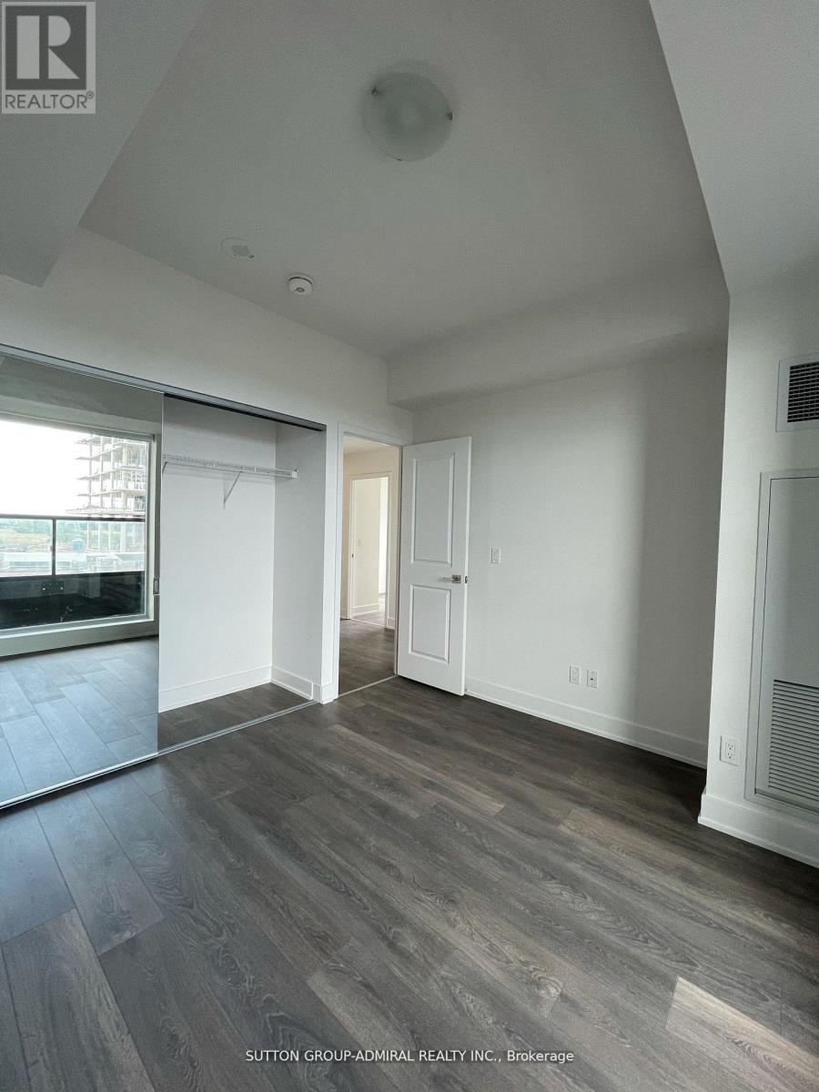 A room with a grey floor and white walls.
