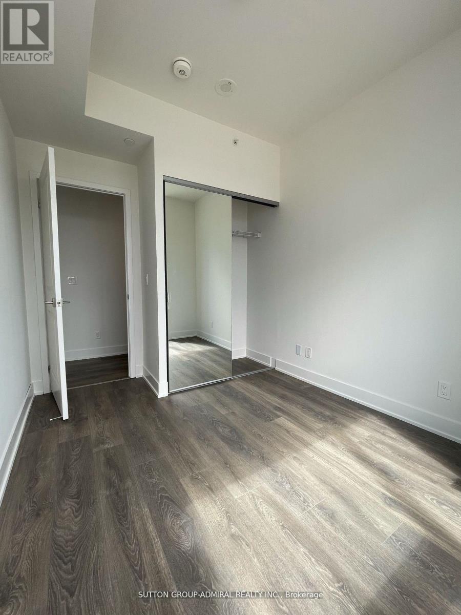 A room with a wooden floor and white walls.
