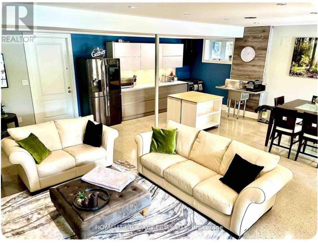 A living room with a white couch and a coffee table.