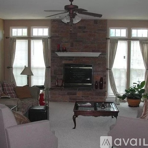 A living room with a fireplace and a couch.