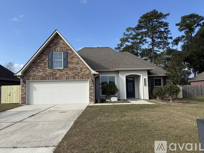 A house with a brick exterior and a white garage door.